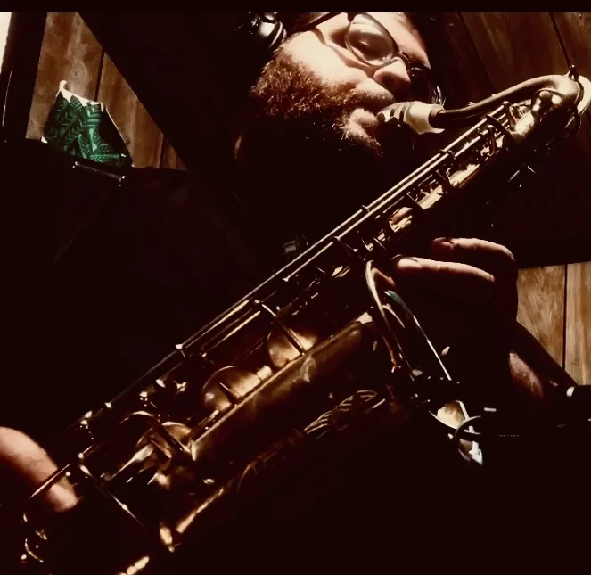 Tito playing tenor saxophone